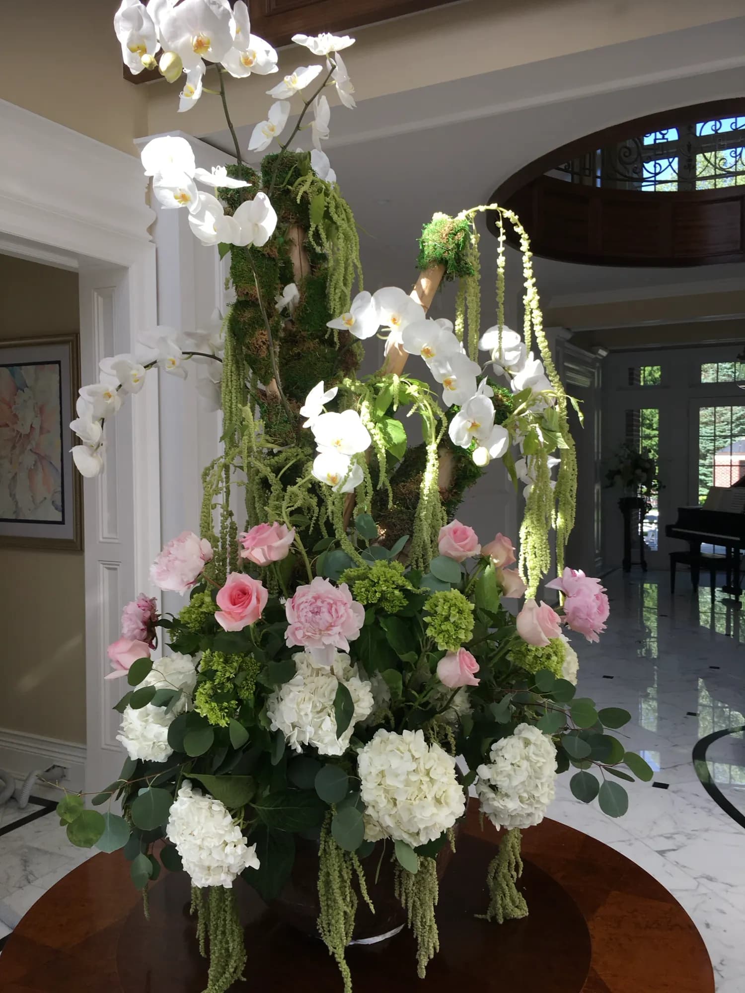 Elegant floral installation at a corporate event by Diva Flowers