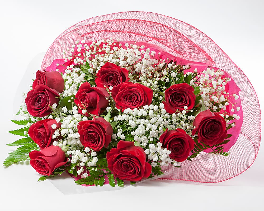 Twelve red roses wrapped in matte paper, tied with cord