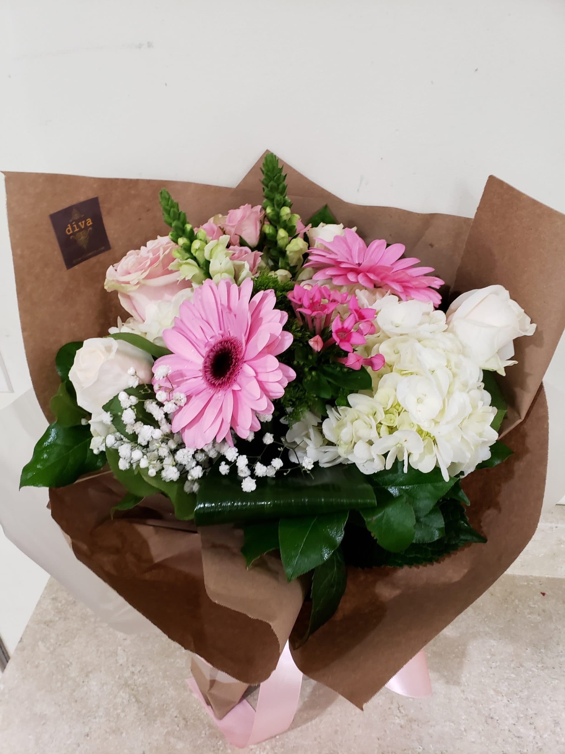 Petal Party bright pink arrangement of roses and gerberas
