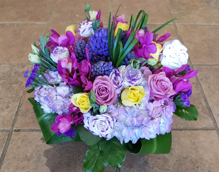 Sugarplum holiday arrangement with burgundy dahlias and plum lisianthus