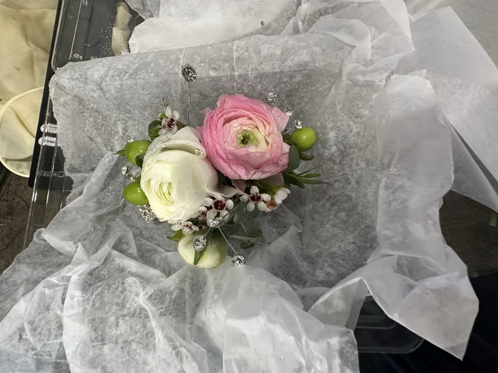 Rose wrist corsage with garden roses and ribbon